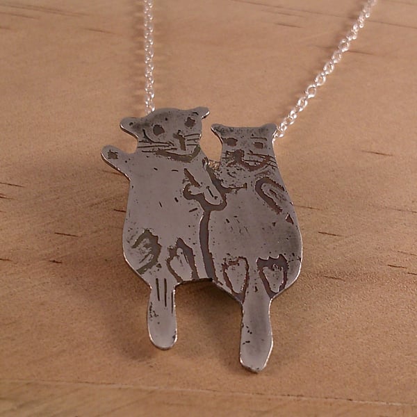 Sterling Silver Pair of Otters Holding Hands Necklace (SKU070325)