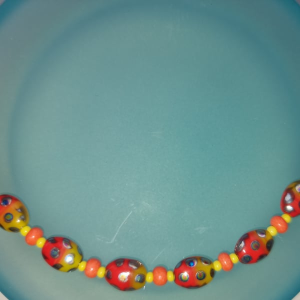 Orange and Yellow beetle bead necklace