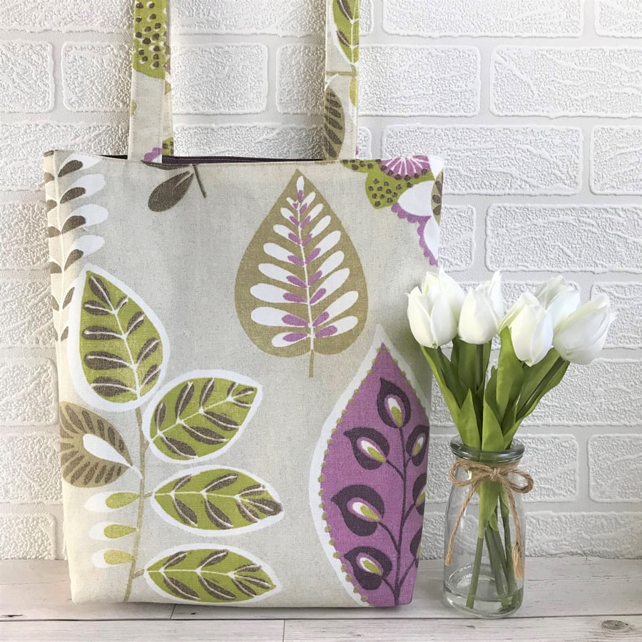 Stylised leaves tote bag in pale beige with green and purple foliage print