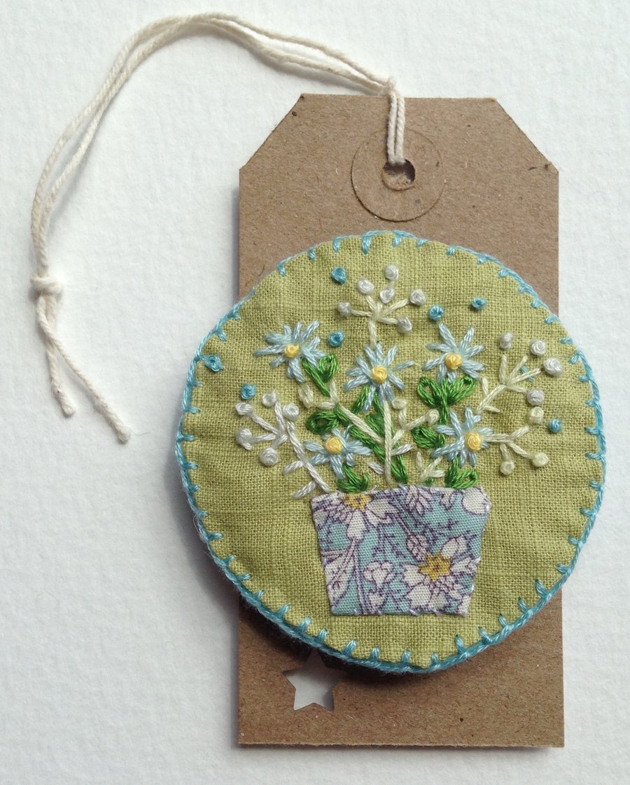 Embroidered linen brooch