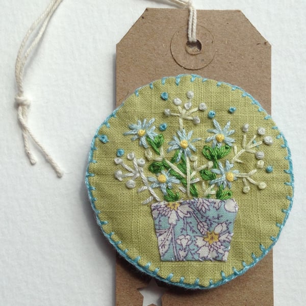 Embroidered linen brooch