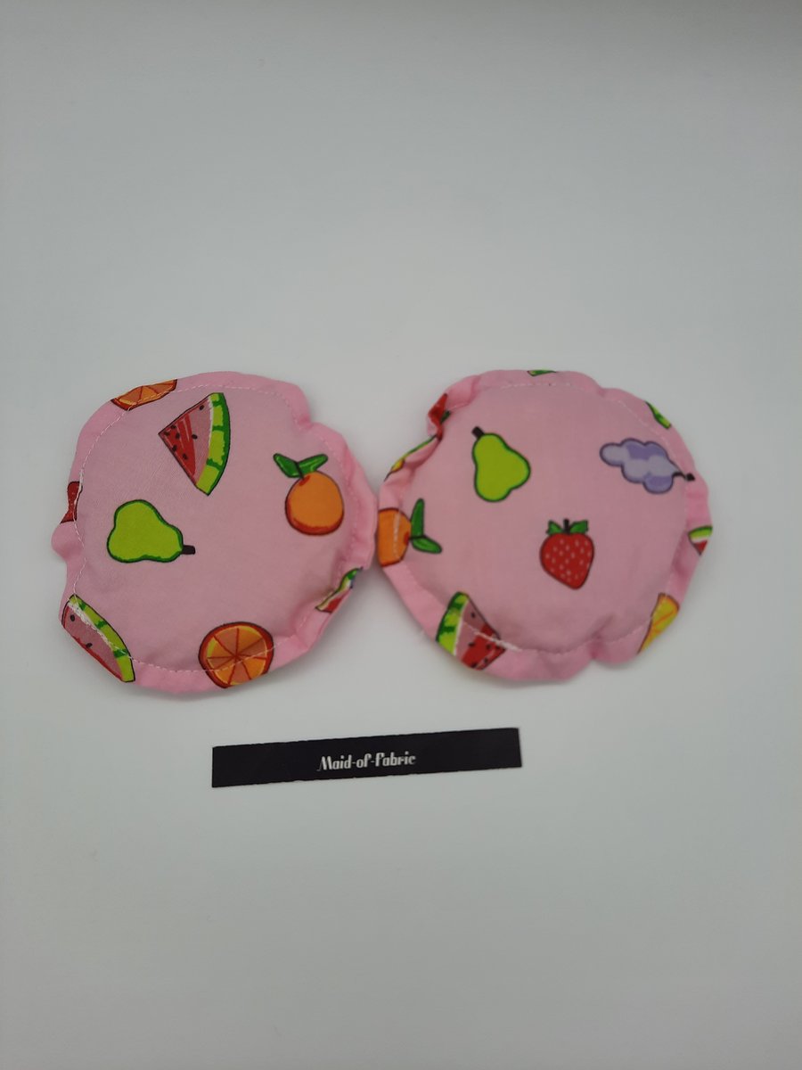 Hand warmers rice filled in pink fruit salad fabric.  