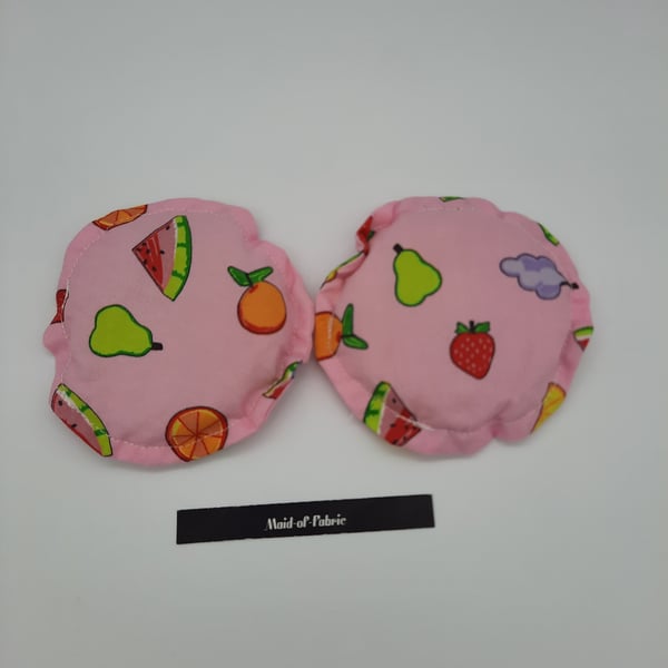 Hand warmers rice filled in pink fruit salad fabric.  