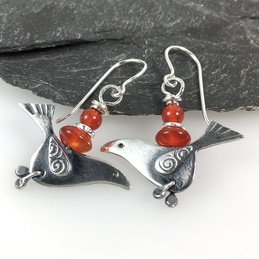 silver bird earrings with juicy orange carnelian.