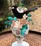 Blackbird sitting in his nest on a small vintage cup - Image 3