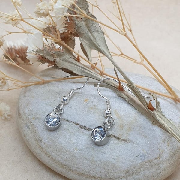 clear glass charms suspend on hypoallergenic silver plated earrings 