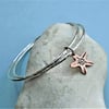 Double bangle with copper flower charm