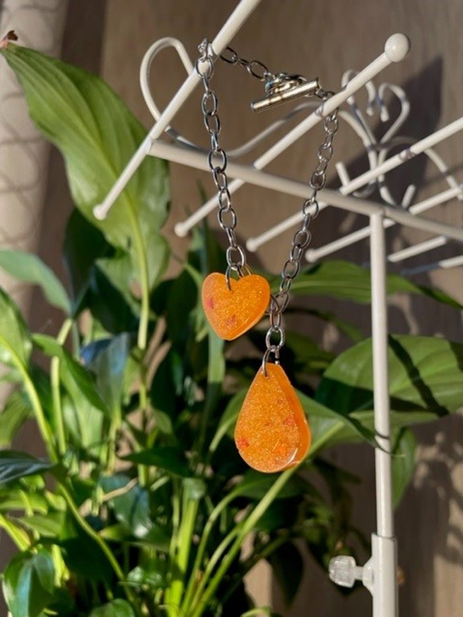 Resin orange glitter butterfly charm bracelet