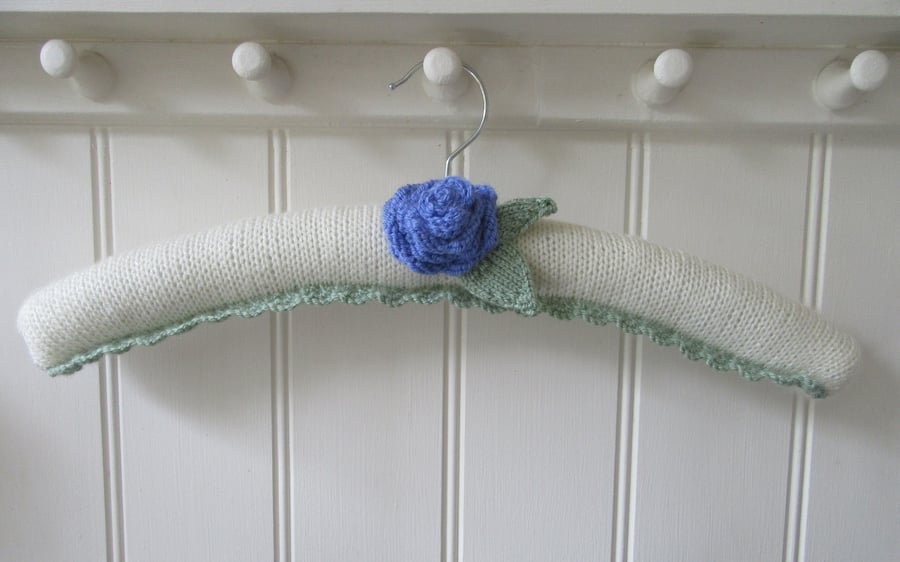 Clothes hanger coat hanger with a bluebell ranunculus flower
