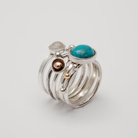 Isabella by Fedha - five silver skinny rings stacked for a boho-chic look
