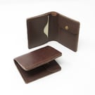 Slim bifold brown leather wallet with pockets for cards, notes and coins