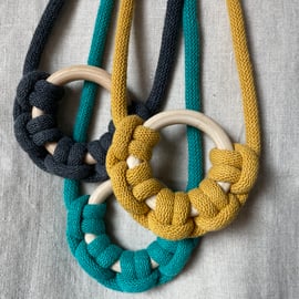 Knotted rope necklace with wooden ring