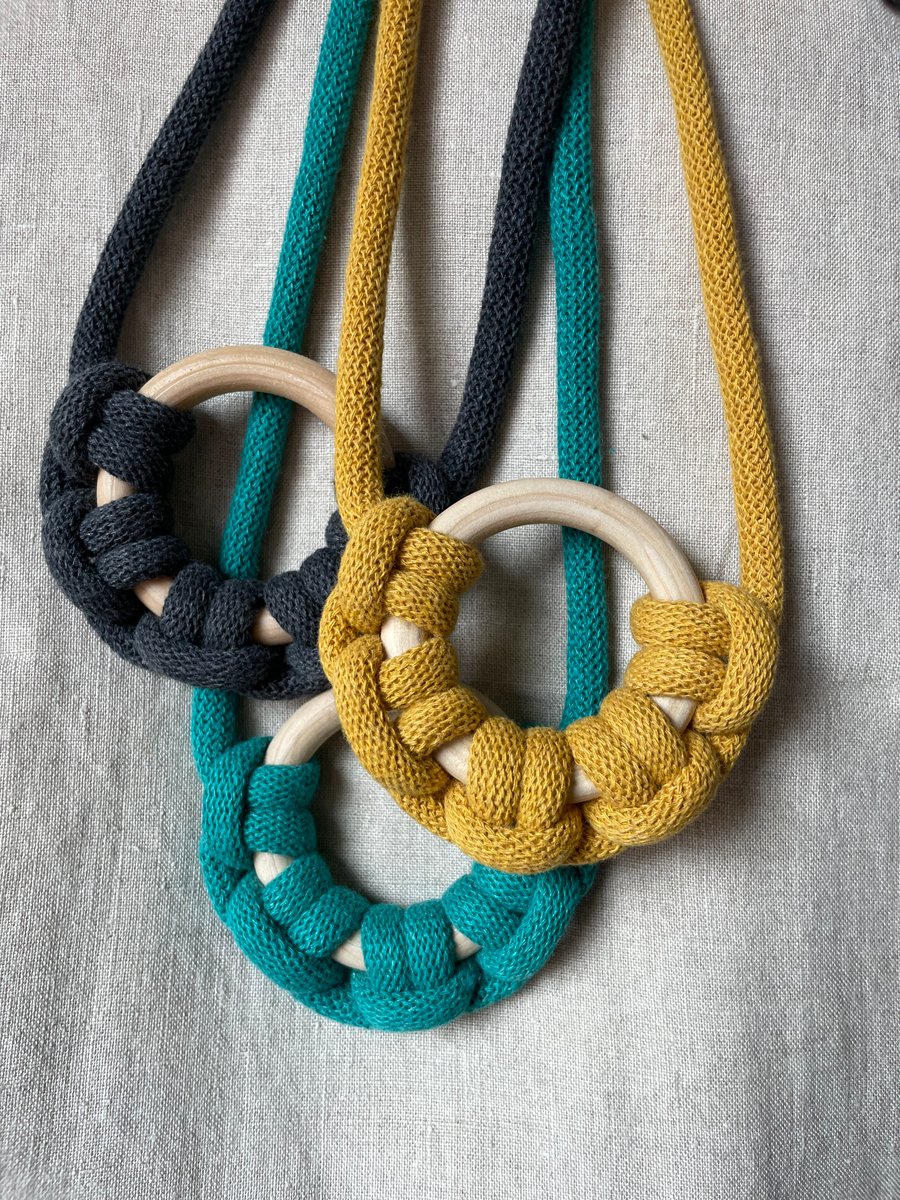 Knotted rope necklace with wooden ring