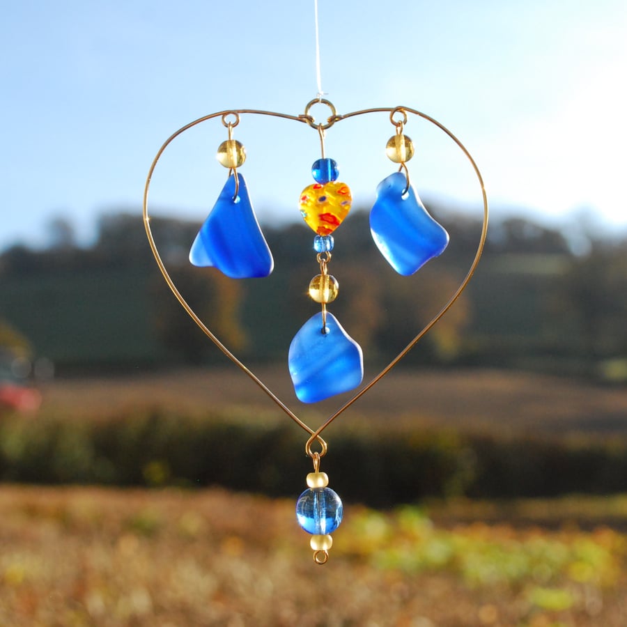Blue beach glass sun catcher with millefiori heart