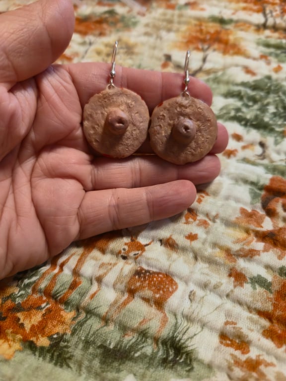 Serial killer trophy sliced off nipple earrings 