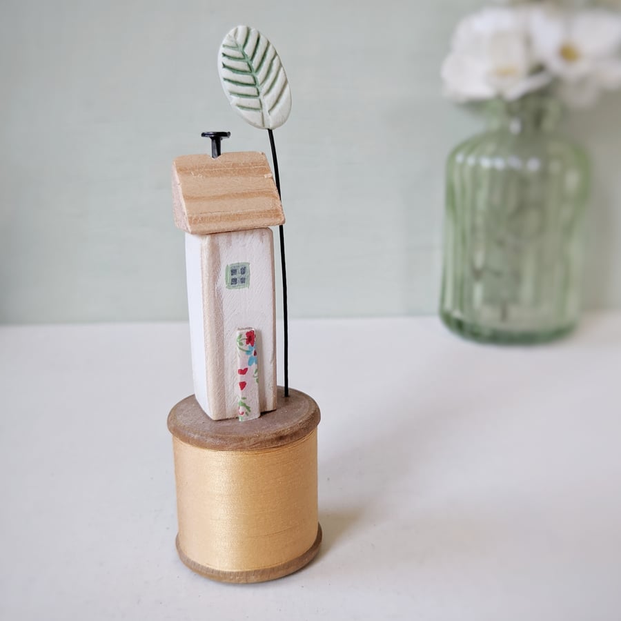 Wooden House on a Vintage Bobbin with Clay Tree