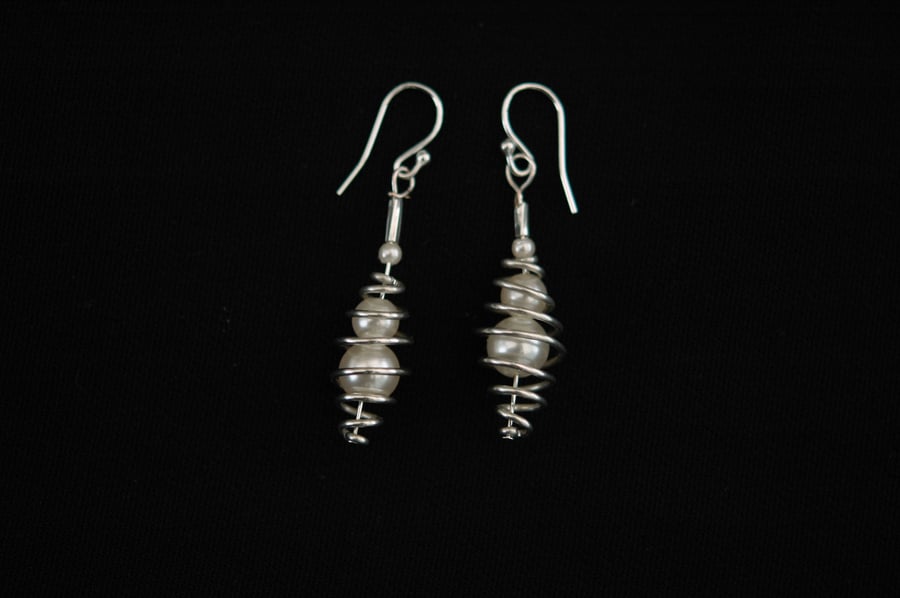Silver spiral earrings with captured pearls, E21