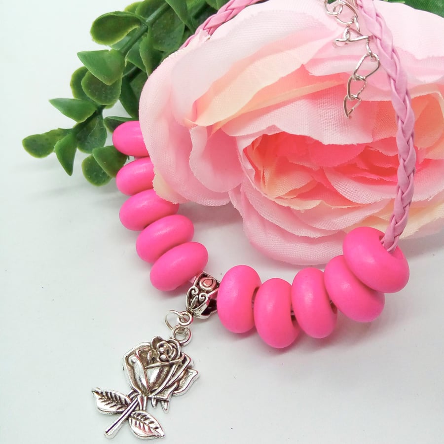 Pink Plaited Leather Bracelet with Pink Wooden Beads and a Silver Rose Charm