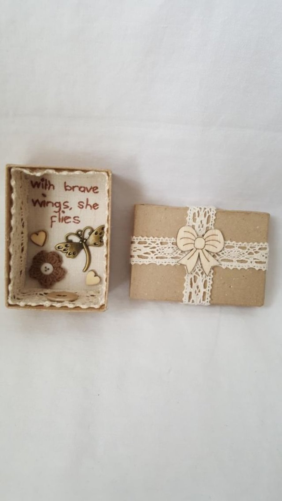 small miniature art diorama with a message 'with brave wings she flies'