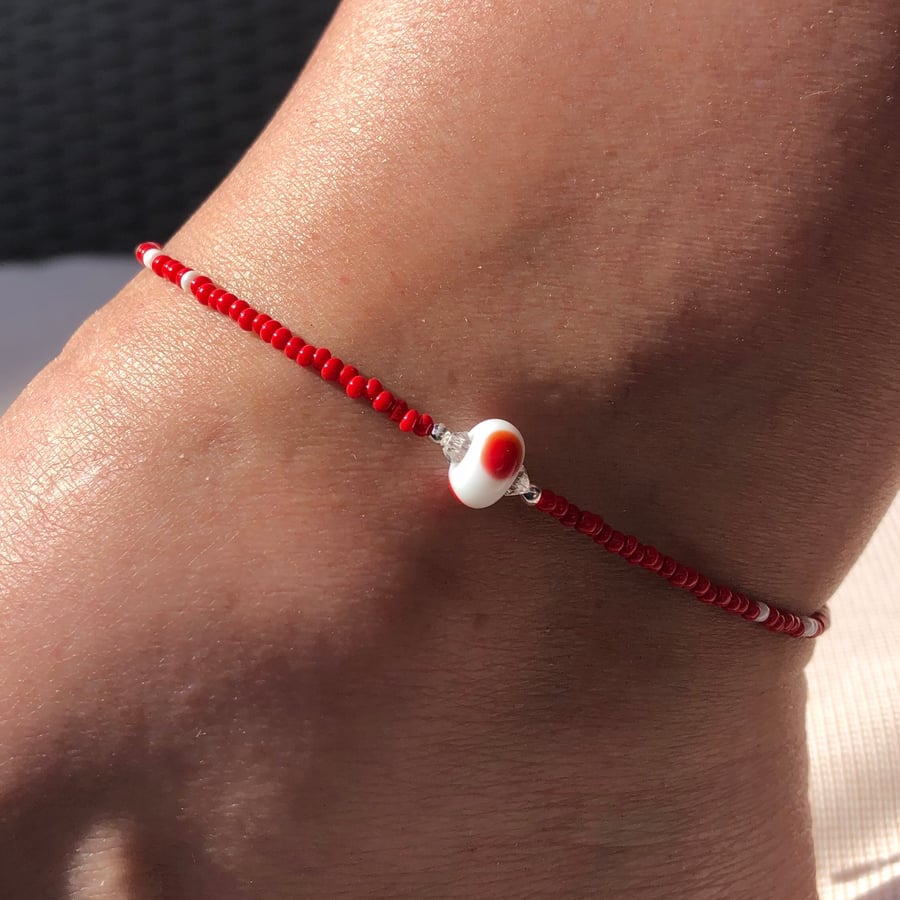 Red & white lamp work glass, sterling silver and seed bead anklet.  
