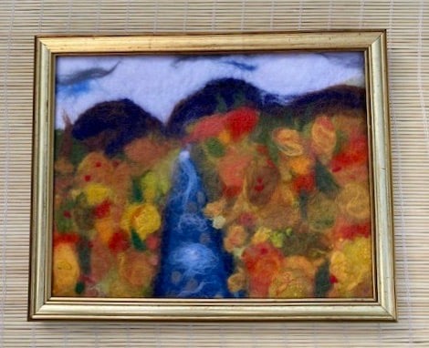 Framed textile Autumn scene picture.