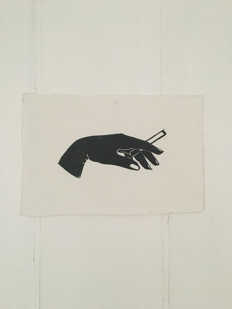 'Noir' linocut print femme fatale hand silhouette holding a cigarette.