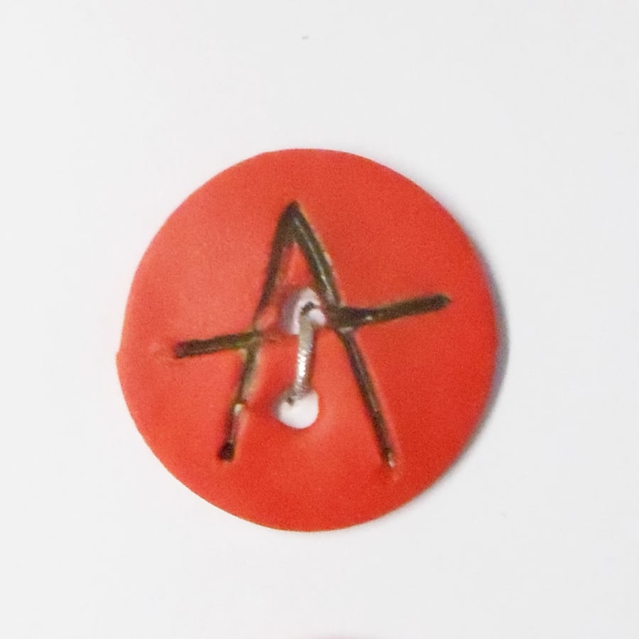 Buttons Black and Red Anarchy Symbol Design on white Porcelain.
