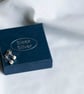 Silver cylindrical ear studs with a brush matte texture - Image 4