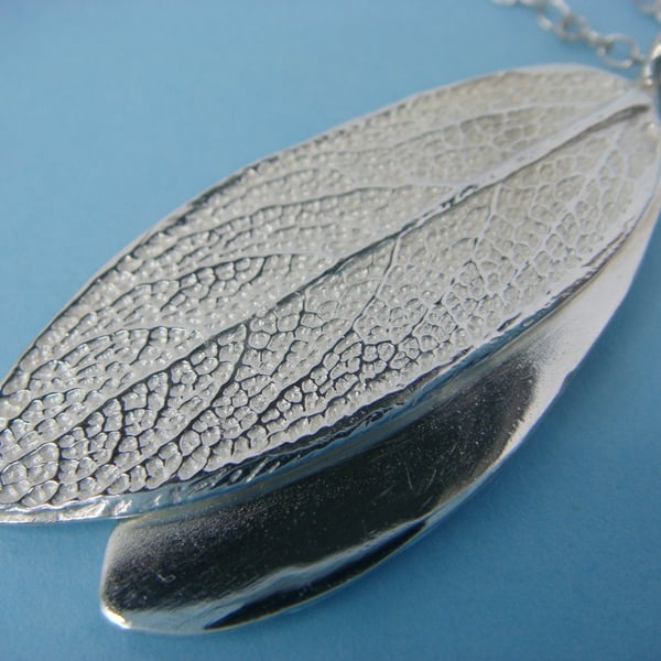 Double sage leaf pendant in fine silver with a silver trace chain. Double sided.
