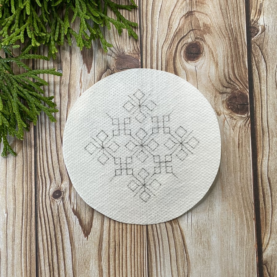 Snowflake stick and stitch embroidery design. DIY Christmas tree bauble pattern.