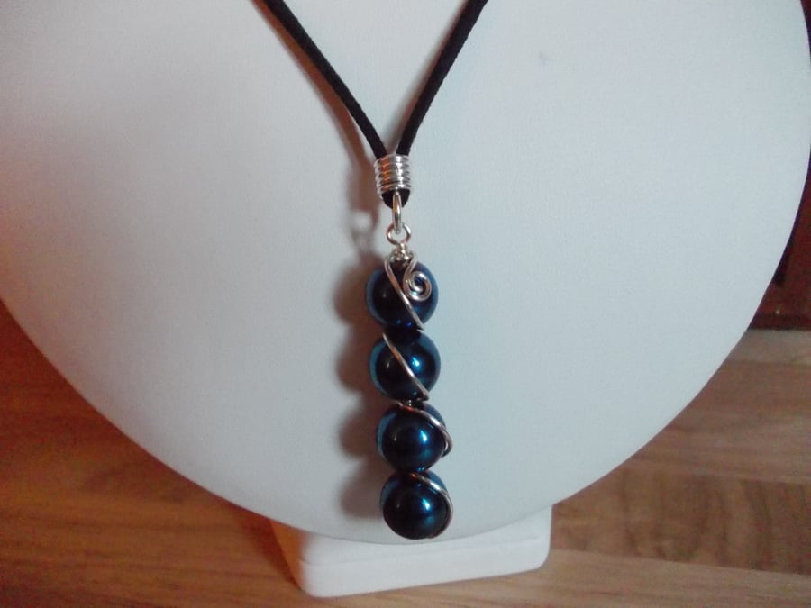 Electric Blue Haematite wire wrapped pendant