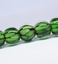 Handmade green snakeskin patterned lamp work glass beads - Image 1