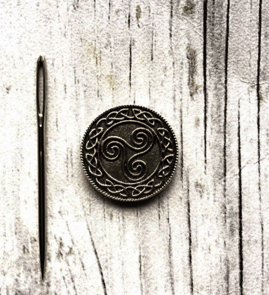 Needle minder or keeper Triskele