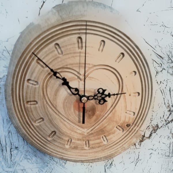 Handcrafted pine wall clock with quartz movement.