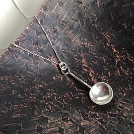 Sterling silver spoon pendant with hammered detail.