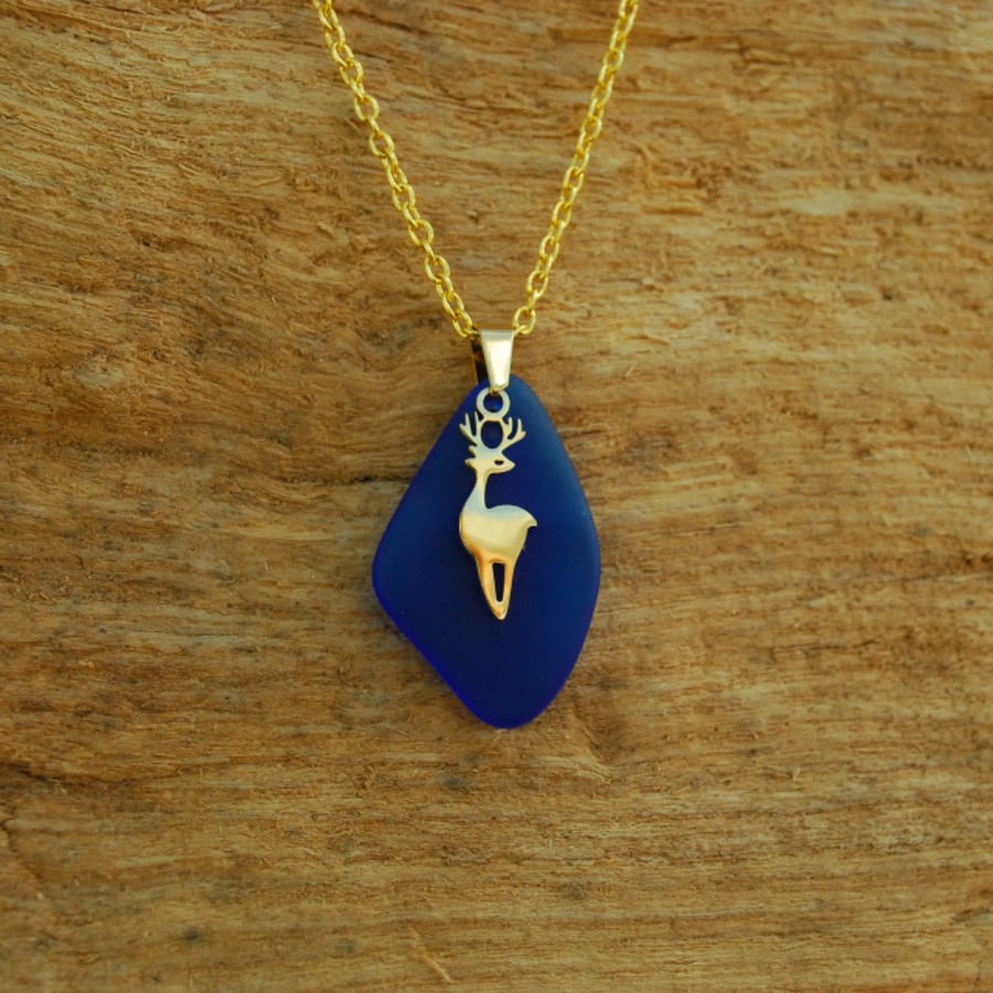 Blue beach glass pendant with tiny deer charm
