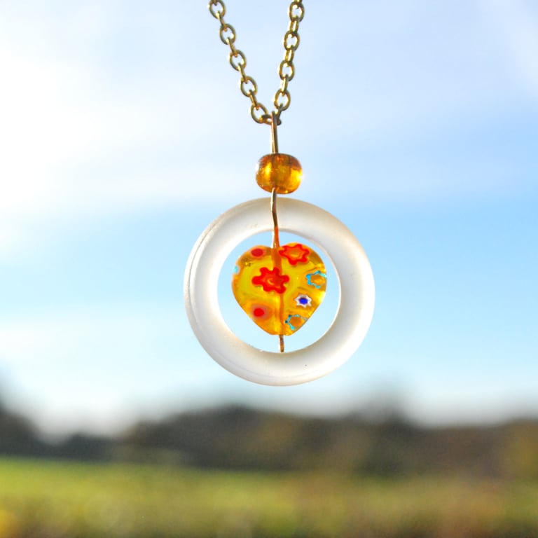 Glass ring pendant with Murano glass heart