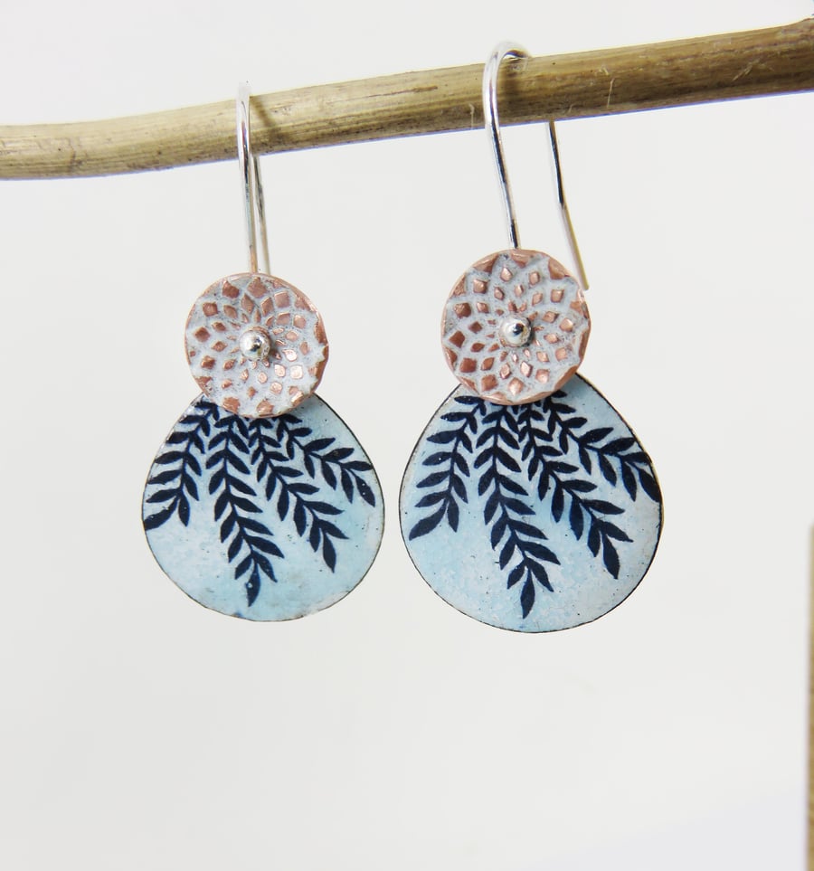 Two enamel on copper disc dangles with textured pattern and leaf design
