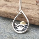 Silver teardrop sun rising over the sea pendant
