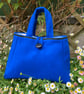 Blue woollen stylish modern handbag.