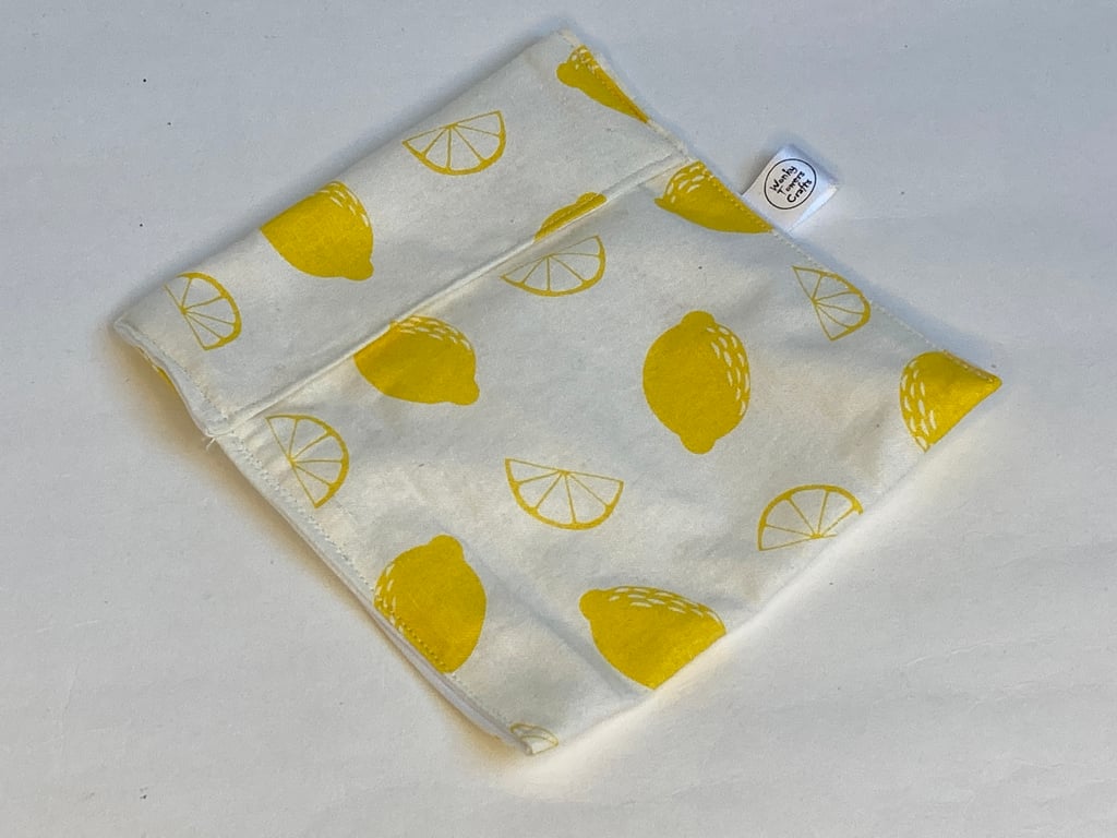 Reusable snack bag with food safe lining. Lemons