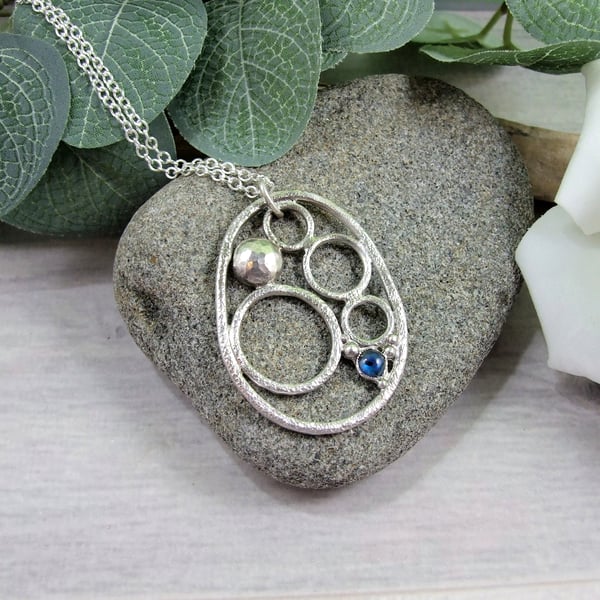 Circles and Pebbles Silver Pendant with Blue Paua Shell
