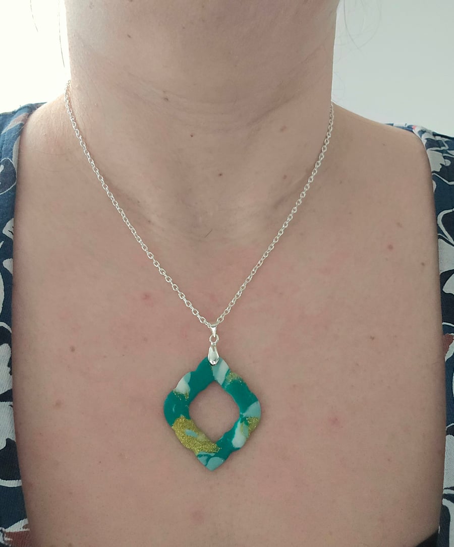Polymer green and gold necklace on a silver plated chain
