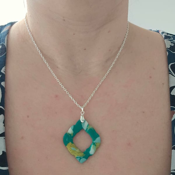 Polymer green and gold necklace on a silver plated chain