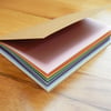 Rainbow Pastel Notebook - 4" x 6" brown kraft cover notebook with rainbow pages 