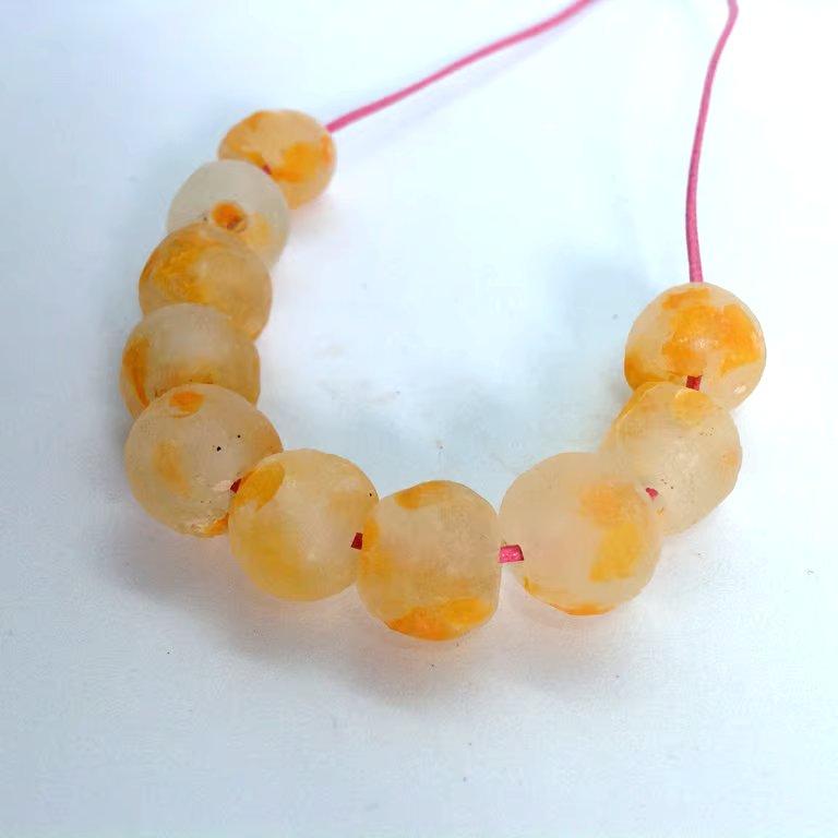 10 African round beads of recycled glass 13 - 15 mm, clear mottled with orange 