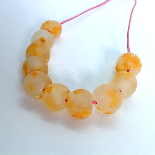 10 African round beads of recycled glass 13 - 15 mm, clear mottled with orange 
