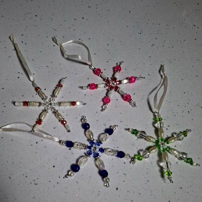 Set of four beaded snowflake decorations