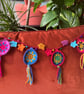 Bauble and Bell Bunting, crochet in jewel colours - Image 1