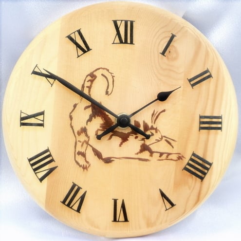 Wooden clock painted with a stretching cat